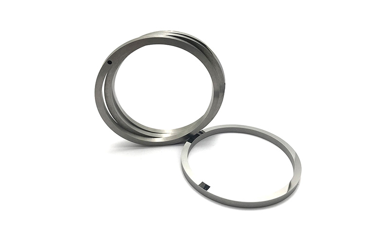 Corrosion-resistant tungsten carbide pump shaft sleeves