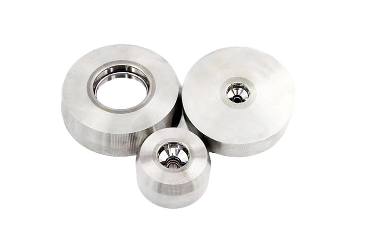 Corrosion-resistant tungsten carbide valve sealing rings