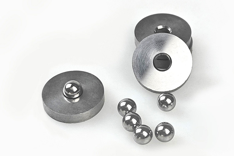 Tungsten carbide valve sealing components with high wear resistance